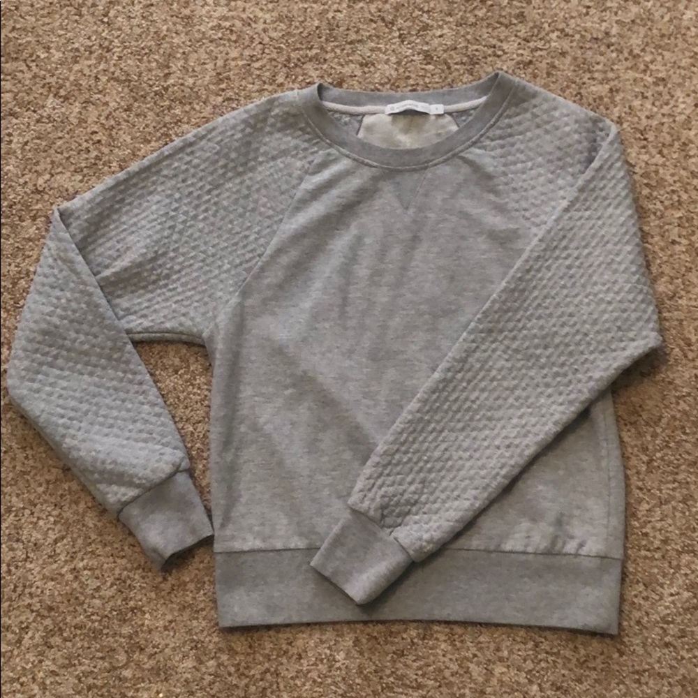 A gray pullover